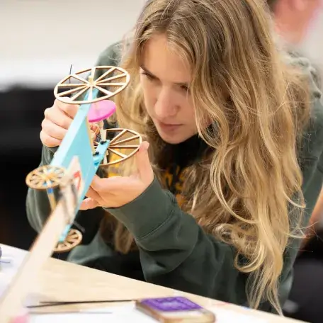 A student works on a prototype in the fabrication lab