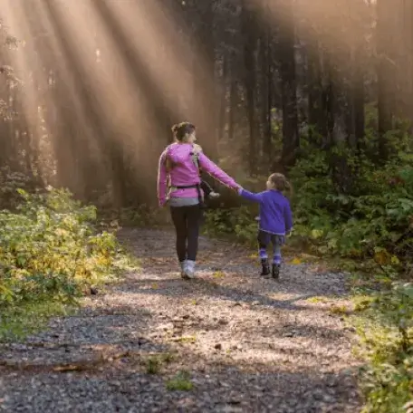 parent walking with child outside