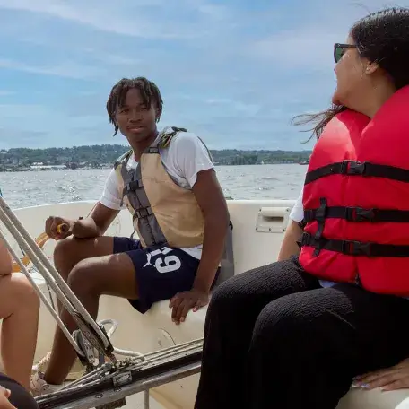 teens in a boat on Lake Champlain