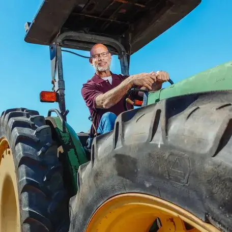 a man in a large tractor
