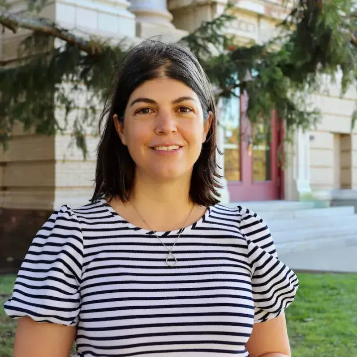 Jacqueline Drouin standing in front of a building