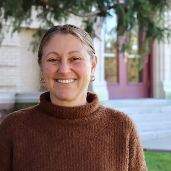 Julie Starr in front of Morrill Hall