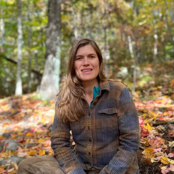 Ali sitting in the woods