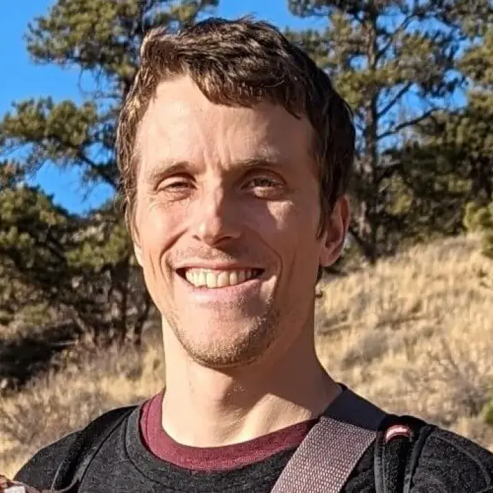 Mattison standing outside on the side of a hill.