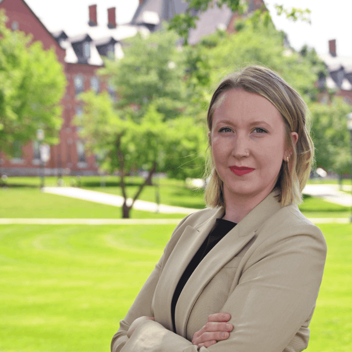 photo of Jenna Batchelder, woman with blond hair standing in front of the UVM campus green