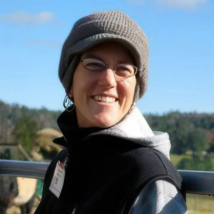 LIz Kenton wearing a hat, outdoors