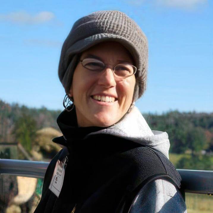 LIz Kenton wearing a hat, outdoors