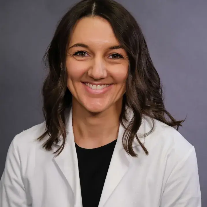 A person wearing a white coat