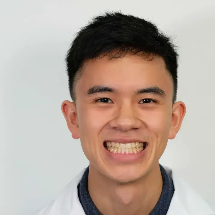 A person wearing a white coat