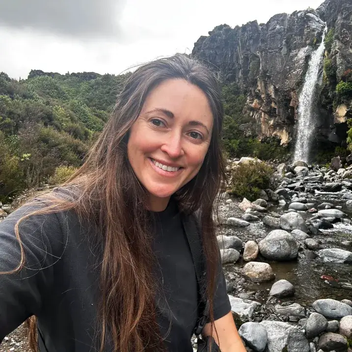Lauren Hunt outdoors by a waterfall
