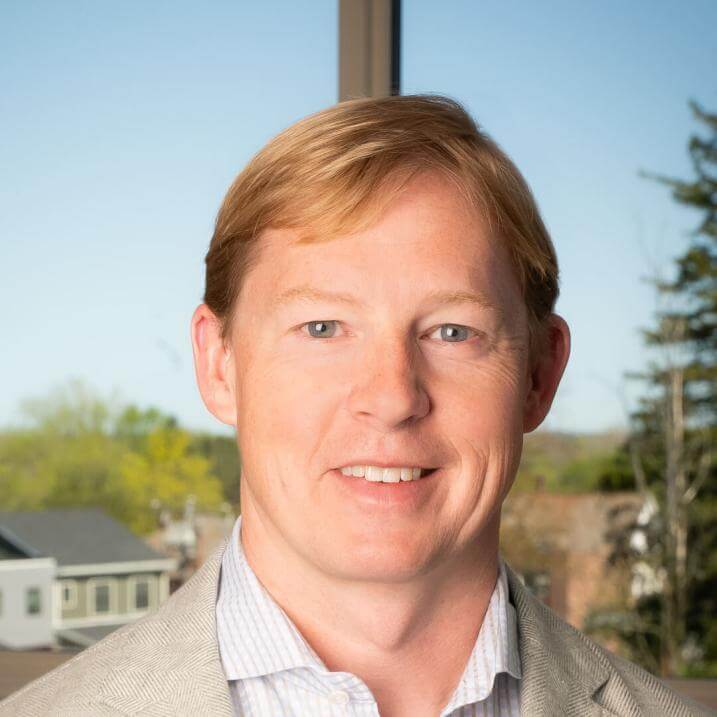 headshot of a man smiling