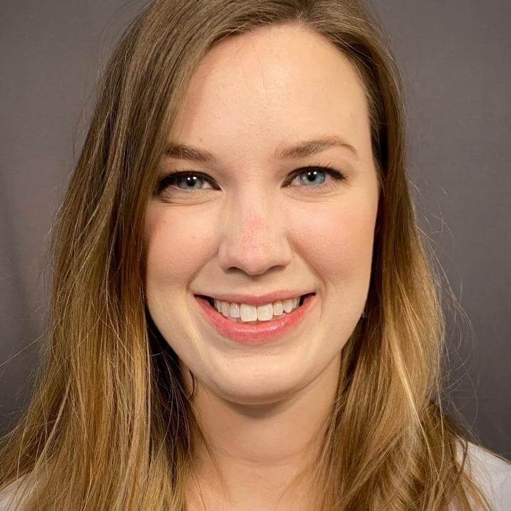 A person wearing a white blouse