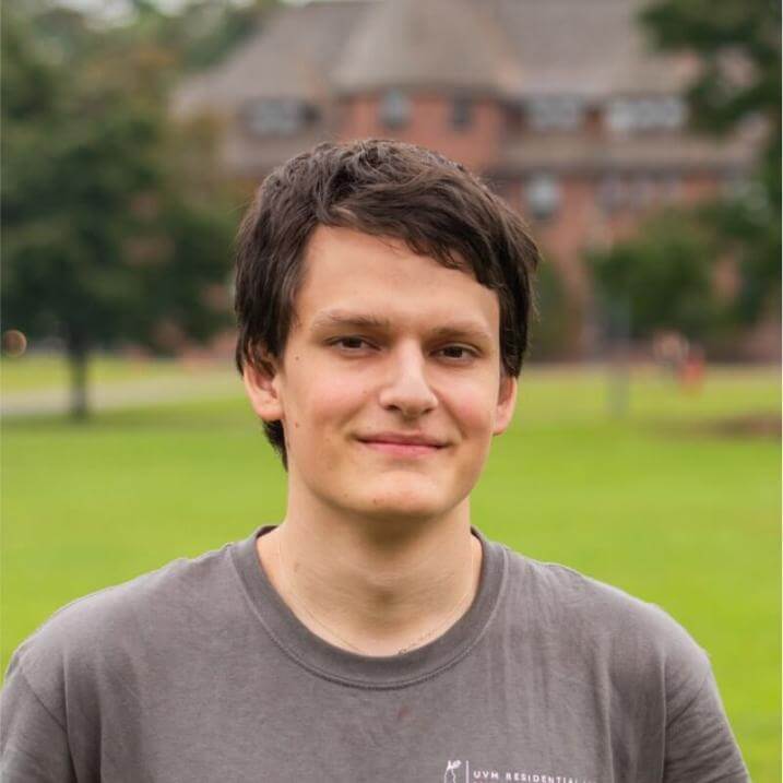 Max Stieglitz, headshot, in front of Redstone Hall