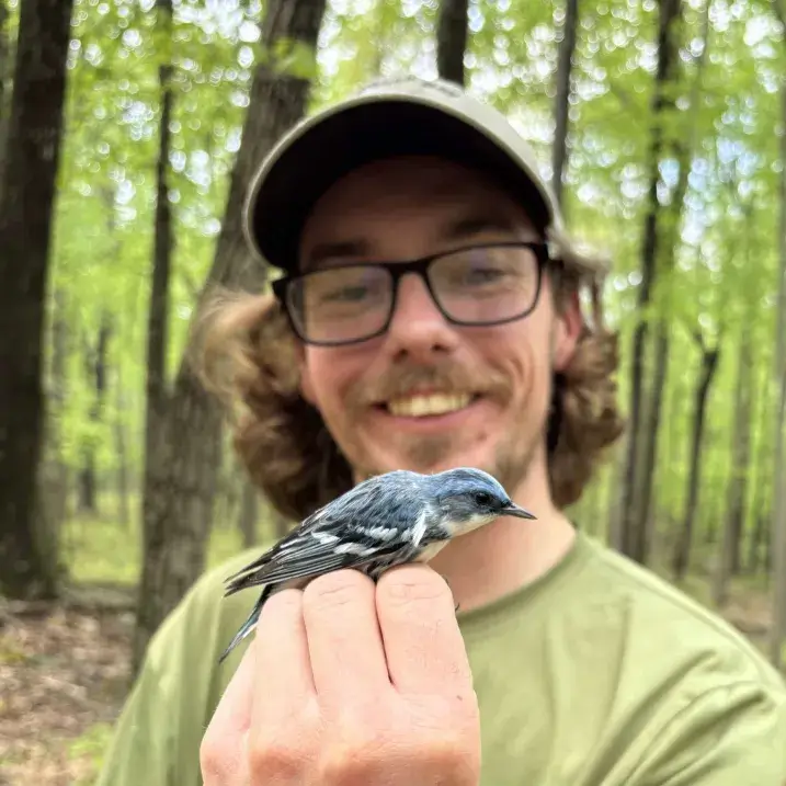 Tyler holding a bird