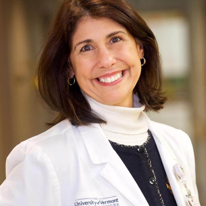 A person wearing a white coat 