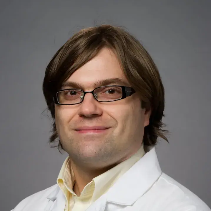 headshot of man in doctors coat