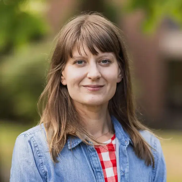 A woman looks at the camera