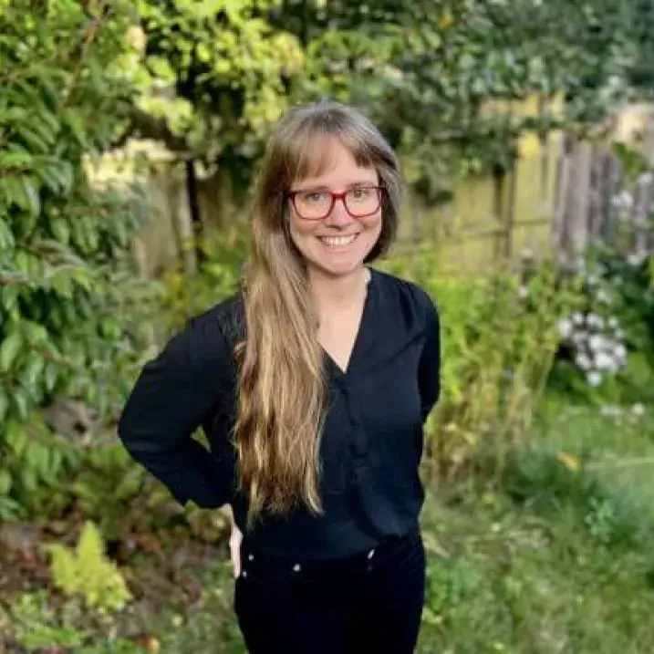 A woman looks at the camera