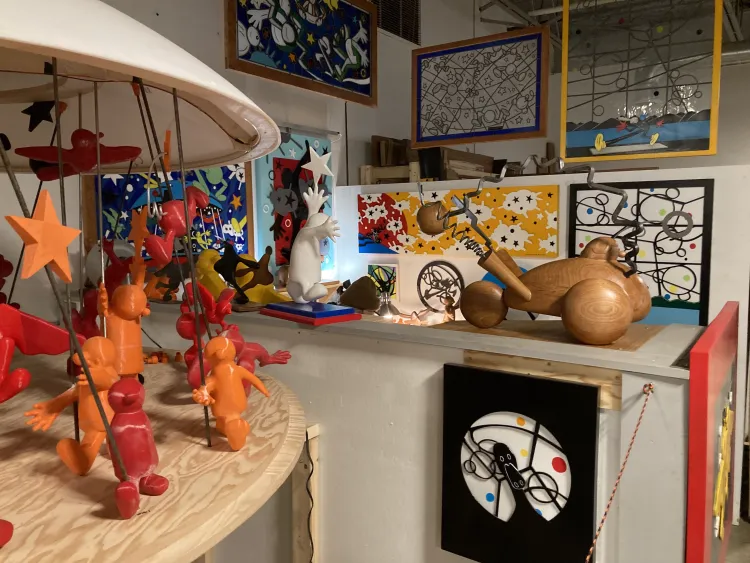 Colorful wooden sculptures near the entrance to Generator Makerspace