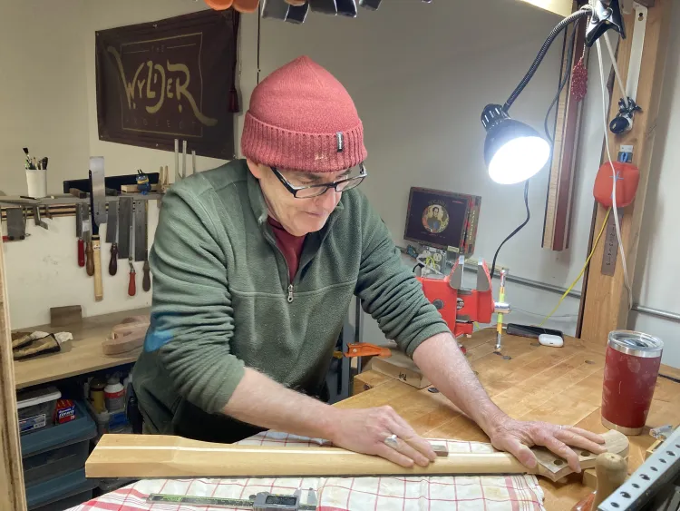 A Generator member works on his designs in his art cubicle