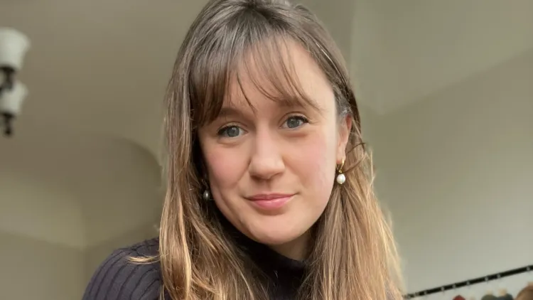 Closeup of Corinne Hensley '17 looking into camera