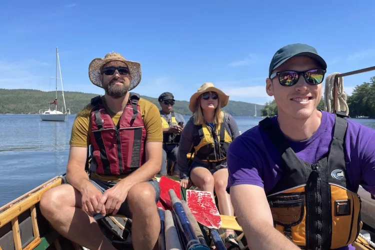 CREST participants on a long boat on Lake Champlain