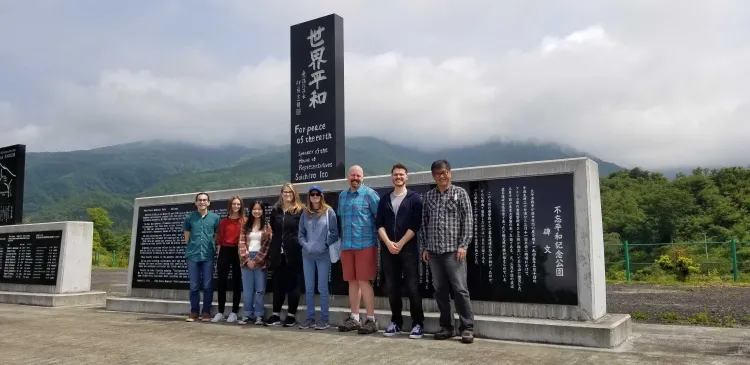 people standing in front of a monument