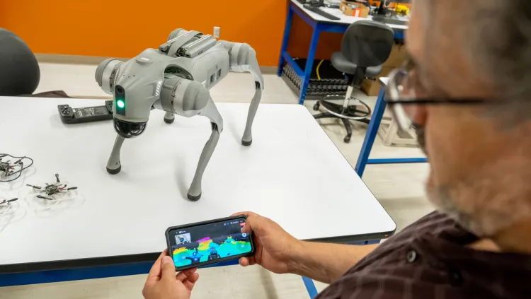 Assistant Professor Luis Duffaut demonstrates a robot's Lidar System