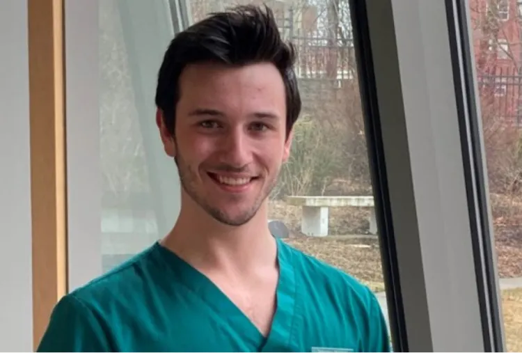 Sebastian Magnotti smiles with window in background