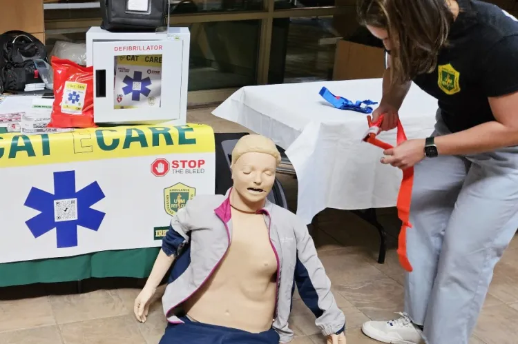 A student Cat ECare instructor with training equipment