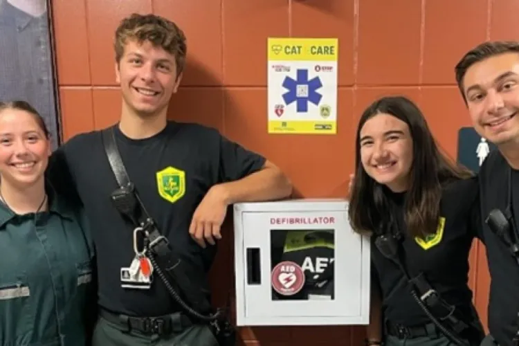 â UVM Rescue volunteers with a newly installed Cat ECare AED station. â