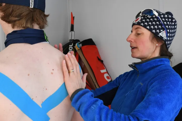 Physical therapist works with winter athlete
