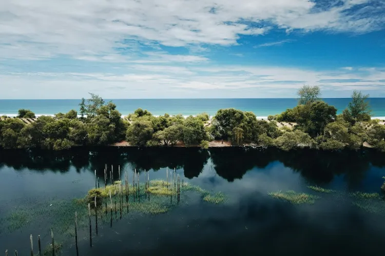 A photograph of a flooded seaside area in Malaysia