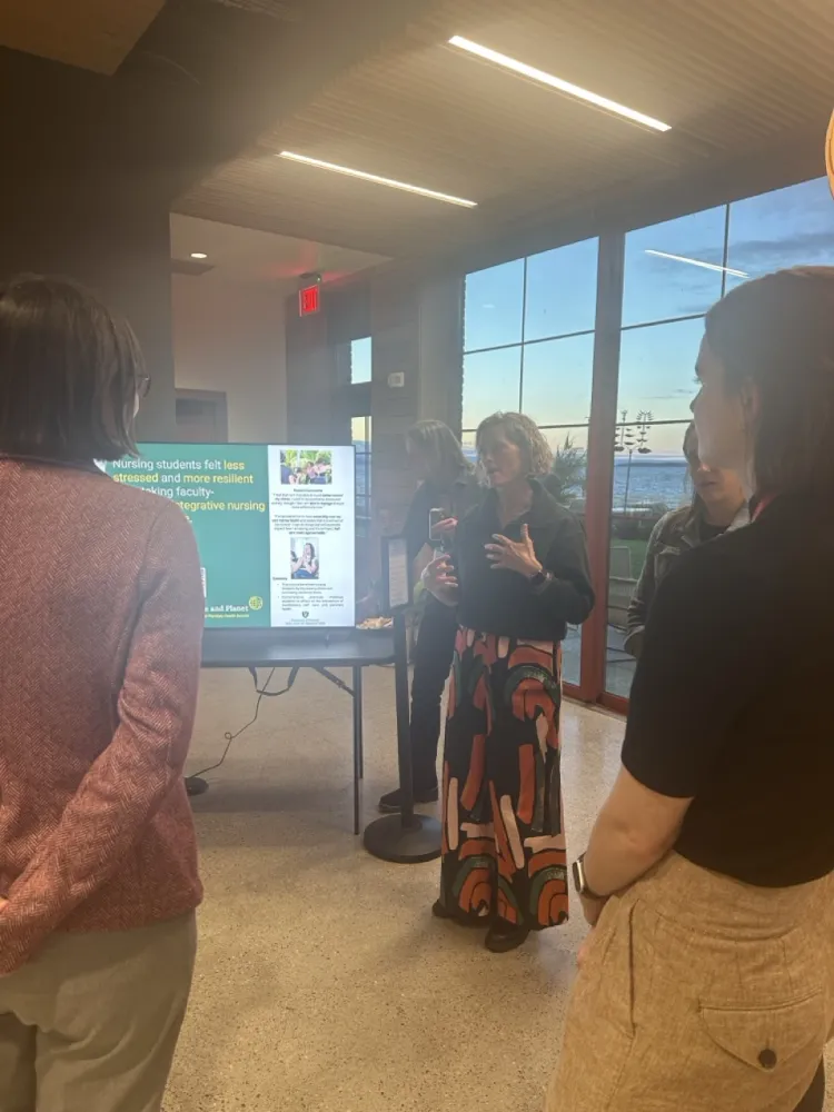 person standing at screen talking