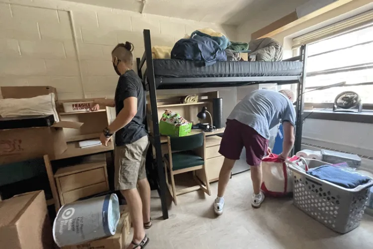 Sam Will and Jonas Campagna mill about their shared dorm room.