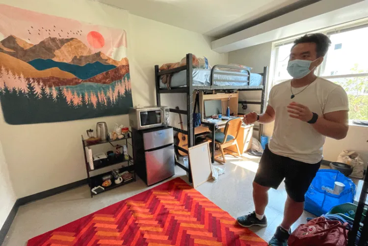 Jamie Dixon in his well-decorated dorm room in University Heights.