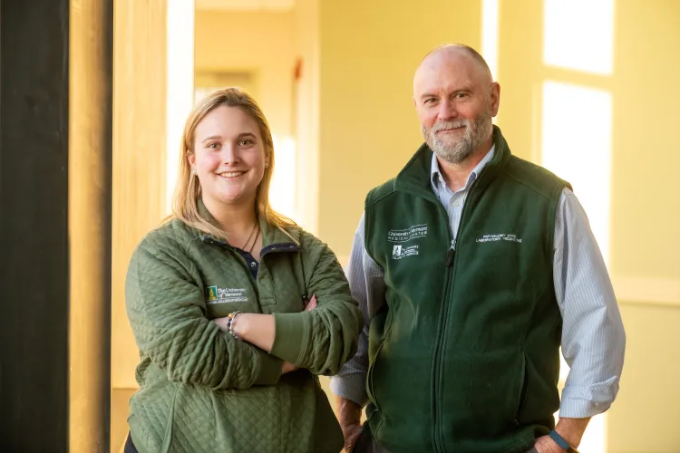 Maggie King and Peter Durda stand in the blood lab where they study RURAL health