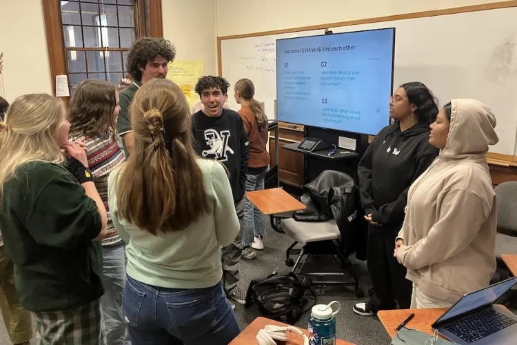 students talking in a classroom