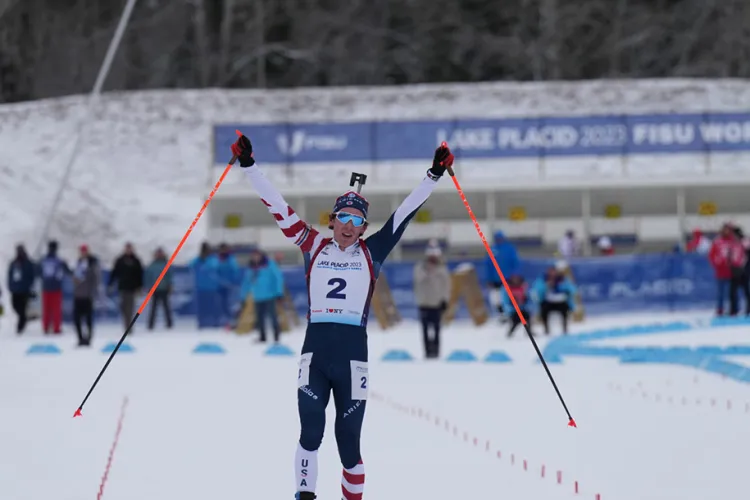 Bjorn Westervalt raises his arms in victory after winning a biathlon race