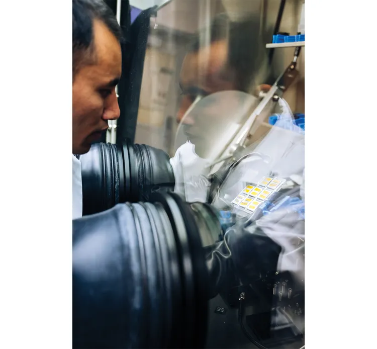 an engineer working through glass