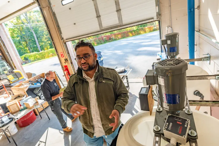 Graduate student Kamruzzaman Khan visits a wastewater treatment faciility