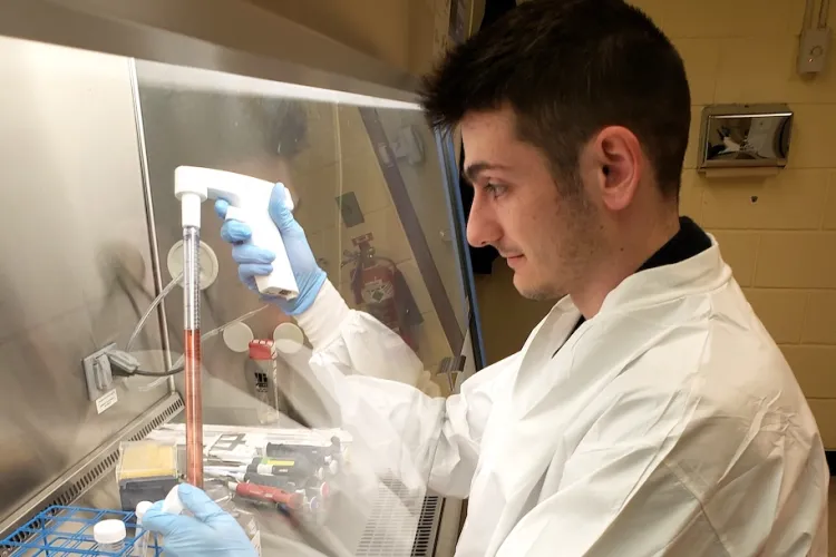 Cole Royer working in a laboratory