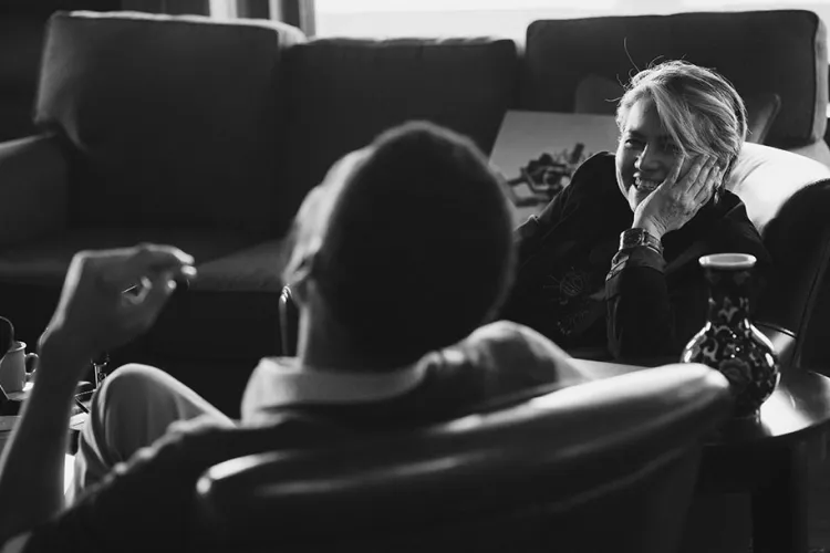 one professor laughs while another talks