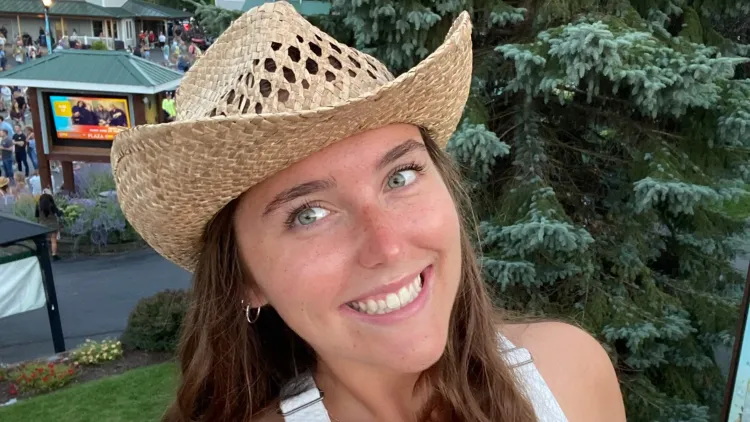 Chloe in a straw cowboy hat.