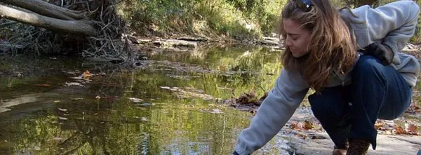 young women by a stream
