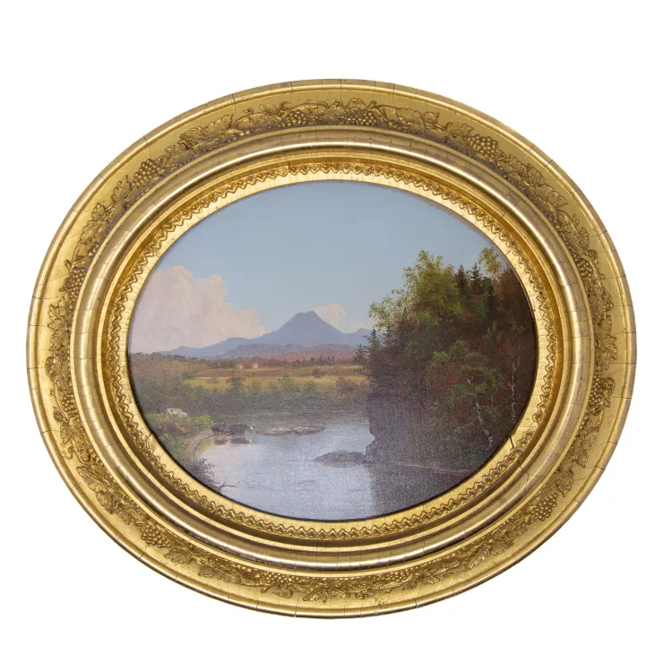 Oval landscape painting in gold frame
