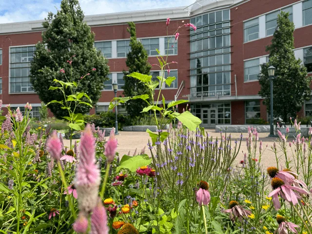 Building with flowers in front of it