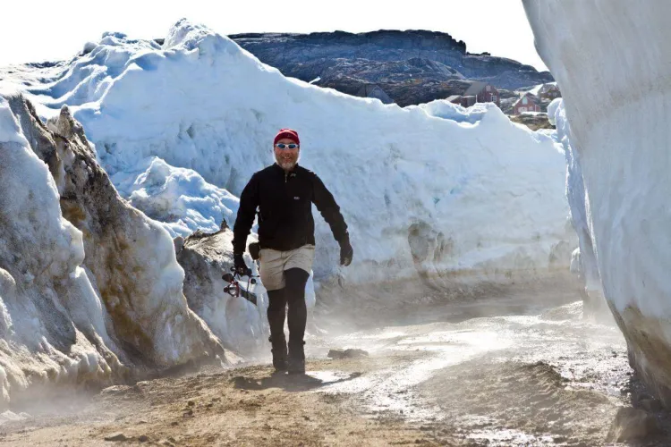Paul Bierman walking amongst ice walls in Greenland