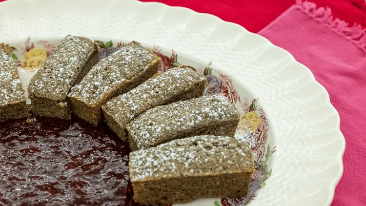 Financiers on a plate with strawberry compote