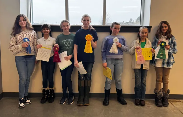 7 kids with prize ribbons